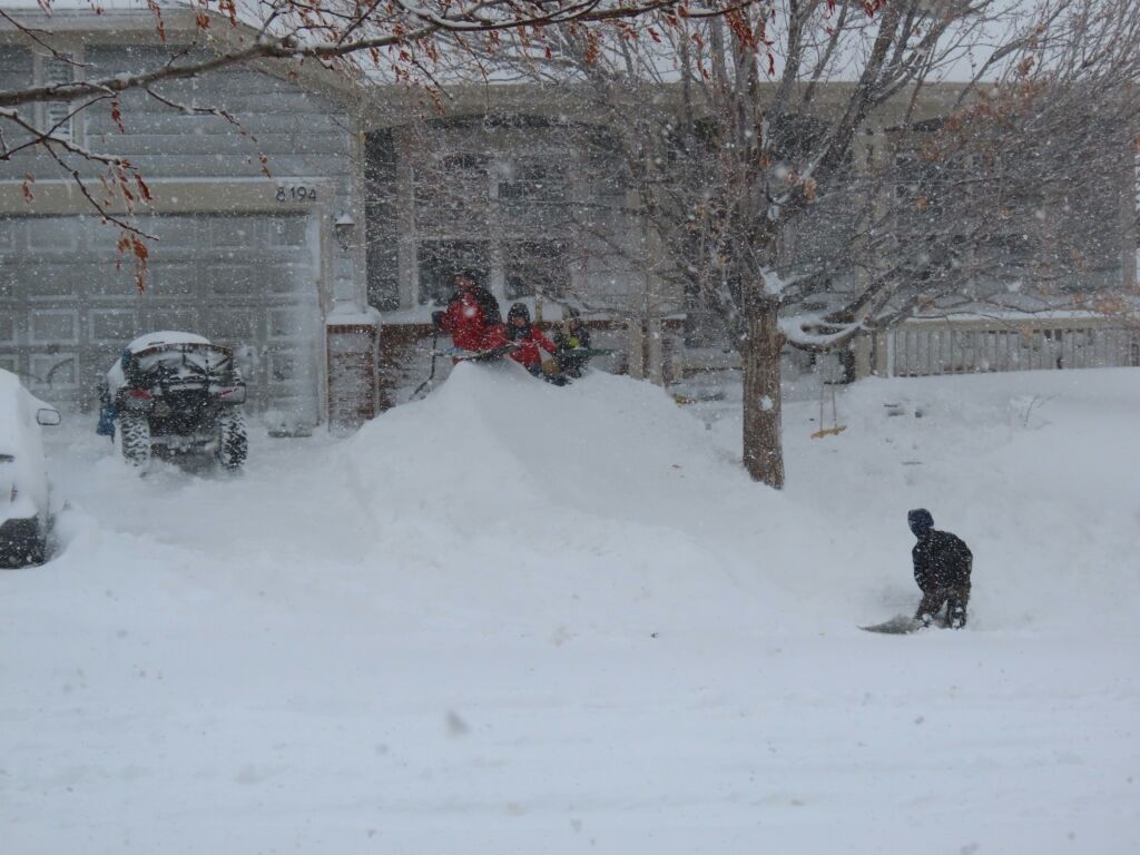 Snow covered residential driveway during heavy winter conditions showing importance of household equipment in bankruptcy cases